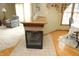 View of the fireplace, breakfast bar, and dining/living room with chair and table at 17003 Whitebark Ct, Westfield, IN 46074