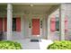 A welcoming front entrance with red door, sidelights and decorative trim provides curb appeal at 17003 Whitebark Ct, Westfield, IN 46074