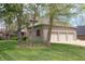 Angled view of the exterior featuring a three car garage and well maintained landscaping at 17003 Whitebark Ct, Westfield, IN 46074
