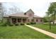 Charming front exterior featuring manicured bushes, red shutters, and a walkway to the front door at 17003 Whitebark Ct, Westfield, IN 46074