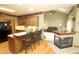 Modern kitchen open to the living room, complete with bar seating and an adjacent fireplace at 17003 Whitebark Ct, Westfield, IN 46074