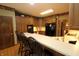 Charming kitchen featuring wood cabinets, light countertops, and built-in appliances for efficient cooking at 17003 Whitebark Ct, Westfield, IN 46074