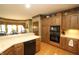 A well-equipped kitchen with wooden cabinetry, modern appliances, and a functional layout for efficient cooking at 17003 Whitebark Ct, Westfield, IN 46074