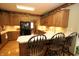 Charming kitchen boasts wood cabinets, light countertops, and bar seating for a cozy and functional space at 17003 Whitebark Ct, Westfield, IN 46074