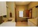 Well-lit laundry room includes a convenient fold-away ironing board and ample countertop space at 17003 Whitebark Ct, Westfield, IN 46074