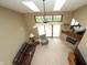 Living room boasts vaulted ceiling, skylights, and fireplace with sliding glass doors to outdoor space at 17003 Whitebark Ct, Westfield, IN 46074