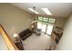 Sunken living room boasts vaulted ceiling, skylights, and fireplace with sliding glass doors to outdoor space at 17003 Whitebark Ct, Westfield, IN 46074