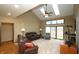 Spacious living room with vaulted ceilings, skylights, plush seating, and fireplace at 17003 Whitebark Ct, Westfield, IN 46074