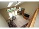 Living room boasts vaulted ceiling, skylights, and fireplace with sliding glass doors to outdoor space at 17003 Whitebark Ct, Westfield, IN 46074