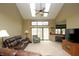Inviting living room with a ceiling fan, fireplace, and sliding glass doors to the outside at 17003 Whitebark Ct, Westfield, IN 46074