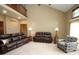 Spacious living room featuring a cathedral ceiling and comfortable leather furniture at 17003 Whitebark Ct, Westfield, IN 46074