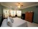 Relaxing main bedroom with ample seating, windows with curtains, and modern furnishings at 17003 Whitebark Ct, Westfield, IN 46074