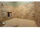 Shower featuring stylish tile walls, built in niche, and a corner seat at 17003 Whitebark Ct, Westfield, IN 46074