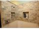 Shower featuring stylish tile walls, built in niche, and a shower head at 17003 Whitebark Ct, Westfield, IN 46074