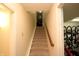 A stairwell leading to the basement with bicycle storage and an open doorway at 17003 Whitebark Ct, Westfield, IN 46074