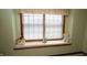 This window seat is brightly lit and includes decorative dolls at 17003 Whitebark Ct, Westfield, IN 46074