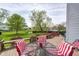 Well-maintained deck with a backyard view, showcasing lush greenery and patio furniture at 1831 Whisperwood Trl, Danville, IN 46122