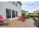 Cozy back deck featuring an outdoor dining set, perfect for entertaining or relaxing in the backyard at 1831 Whisperwood Trl, Danville, IN 46122