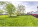 Large grassy backyard offering plenty of space for outdoor activities and potential landscaping projects at 1831 Whisperwood Trl, Danville, IN 46122