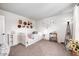 Cozy bedroom with daybed, unique wall decorations, and inviting natural light at 1831 Whisperwood Trl, Danville, IN 46122