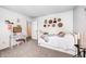 Bright bedroom featuring a daybed, desk, and decor at 1831 Whisperwood Trl, Danville, IN 46122