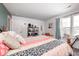 Bright bedroom with accent wall, stylish decor, and natural light at 1831 Whisperwood Trl, Danville, IN 46122