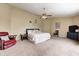 Spacious main bedroom with vaulted ceiling, fan, and plush carpeting at 1831 Whisperwood Trl, Danville, IN 46122