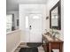 Inviting entryway featuring a console table with decor, a mirror, and stylish flooring at 1831 Whisperwood Trl, Danville, IN 46122