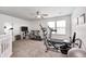 Carpeted upstairs room with exercise equipment and a ceiling fan at 1831 Whisperwood Trl, Danville, IN 46122
