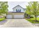 Charming two-story home features a spacious three-car garage and a well-maintained front yard at 1831 Whisperwood Trl, Danville, IN 46122