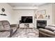 Relaxing living room featuring a fireplace, media center, and comfortable, oversized seating at 1831 Whisperwood Trl, Danville, IN 46122