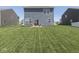 Spacious backyard featuring lush green grass and an inviting patio set at 192 Bluestem Ln, Whiteland, IN 46184