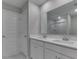 Modern bathroom featuring double sinks and a glass shower at 192 Bluestem Ln, Whiteland, IN 46184