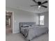 Tranquil bedroom with a ceiling fan and open doorway at 192 Bluestem Ln, Whiteland, IN 46184