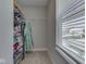 Walk-in closet with built in shelving and a window allowing natural light at 192 Bluestem Ln, Whiteland, IN 46184