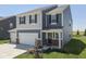 Charming two-story home with a two-car garage and lovely landscaping at 192 Bluestem Ln, Whiteland, IN 46184