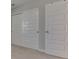 Hallway with large closet doors, providing ample storage space at 192 Bluestem Ln, Whiteland, IN 46184