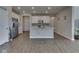 Open kitchen with stainless appliances, white cabinets, and a central island at 192 Bluestem Ln, Whiteland, IN 46184