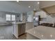 Kitchen with stainless steel appliances, granite countertops and view into living room at 192 Bluestem Ln, Whiteland, IN 46184