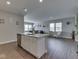 Kitchen island view showing sink, dishwasher, and view into the living room at 192 Bluestem Ln, Whiteland, IN 46184