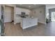 Modern kitchen with stainless appliances, granite countertops and island at 192 Bluestem Ln, Whiteland, IN 46184