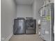 Bright laundry room featuring a washer, dryer, and water heater at 192 Bluestem Ln, Whiteland, IN 46184