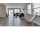 Bright and airy living room with large windows and hardwood floors at 192 Bluestem Ln, Whiteland, IN 46184