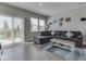 Spacious living room with comfortable sectional sofa and backyard access at 192 Bluestem Ln, Whiteland, IN 46184