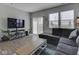 Modern living room with stylish decor and sliding glass doors to the patio at 192 Bluestem Ln, Whiteland, IN 46184