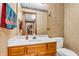 Bathroom with single vanity and toilet; decorated with patterned wallpaper and a bright-colored towel at 1934 Constitution St, Greenfield, IN 46140