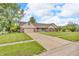 Exterior view of home featuring an attached garage and well-kept lawn at 1934 Constitution St, Greenfield, IN 46140