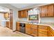 Classic kitchen featuring a window over the sink and warm wood cabinetry at 1934 Constitution St, Greenfield, IN 46140