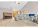 Bright living room with piano, comfortable seating, and seamless flow into the entry way of the home at 1934 Constitution St, Greenfield, IN 46140