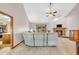 Open-concept living room featuring a brick fireplace, sliding glass door to deck, and seamless flow to the kitchen at 1934 Constitution St, Greenfield, IN 46140